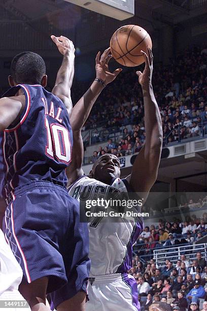 Anthony Mason of the Milwaukee Bucks rebounds the ball against Derrick Dial of the new Jersey Nets during the NBA game at the Bradley Center in...