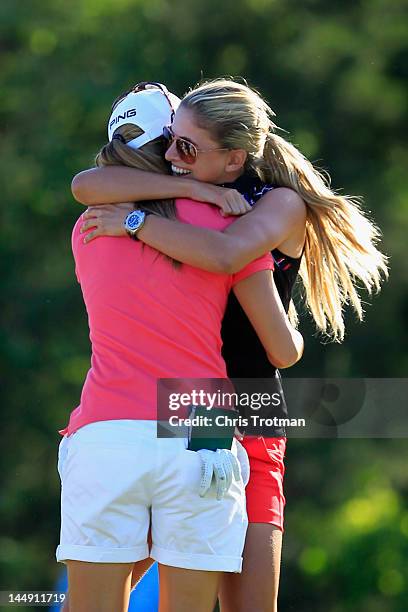 Azahara Munoz of Spain is congratulated by LPGA golfer Belen Mozo of Spain after defeating Candie Kung of Taiwan in the championship match at the...