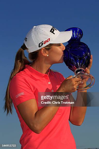 Azahara Munoz of Spain poses with the trophy following her victory over Candie Kung of Taiwan in the championship match at the Sybase Match Play...