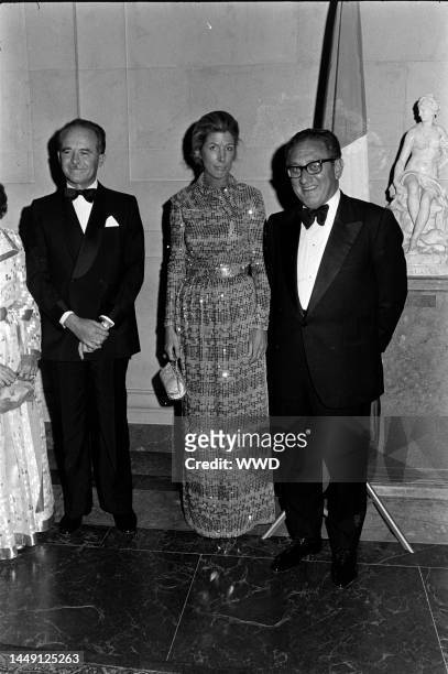 Jean Sauvagnargues, and Henry Kissinger attend a party at the National Gallery of Art in Washington, D.C., on September 27, 1974.