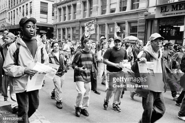 View of marchers, several with signs, during the demonstration , in SoHo, New York, New York, May 1, 1992. The protest was held shortly after the...