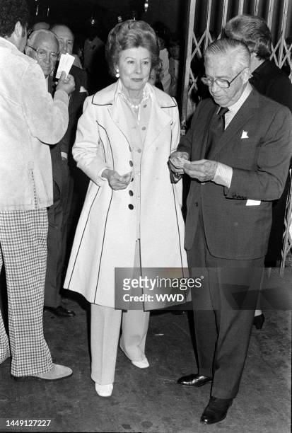 Jules Stein, Irene Dunne, and Francis Dennis Griffin attend Elton John's concert at the Forum in Los Angeles, California, on October 4, 1974.