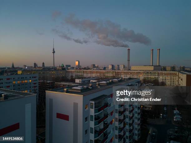 In this aerial view, exhaust rises from chimneys of the Heizkraftwerk Mitte natural gas-powered thermal power plant during a day of sub-zero...