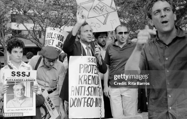 View of demonstrators, many with signs, behind a barricade, during a Freedom for Soviet Jews demonstration organized by the Student Struggle for...