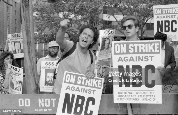 View of strikers and demonstrators, some with signs, behind a barricade, during a Freedom for Soviet Jews demonstration organized by the Student...