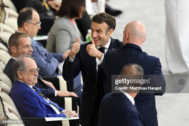 Gianni Infantino, President of FIFA, interacts with French President Emmanuel Macron prior to the FIFA World Cup Qatar 2022 semi final match between...