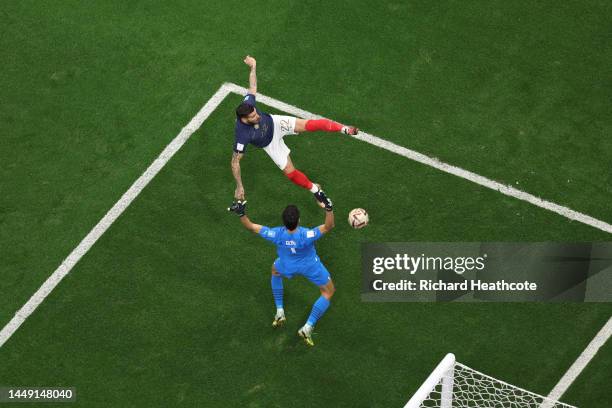 Theo Hernandez of France scores the team's first goal past Yassine Bounou of Morocco during the FIFA World Cup Qatar 2022 semi final match between...