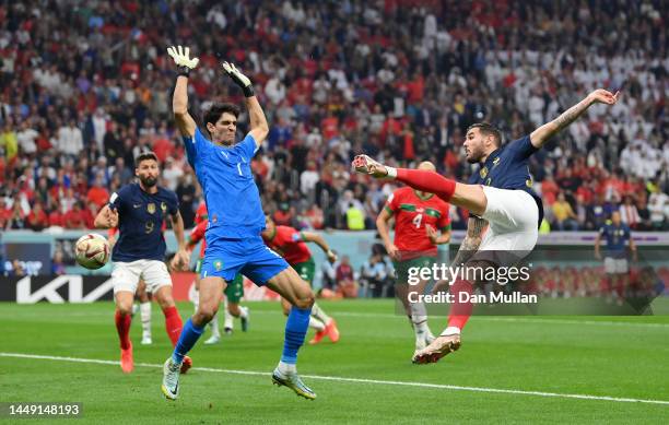 Theo Hernandez of France scores the team's first goal past Yassine Bounou of Morocco during the FIFA World Cup Qatar 2022 semi final match between...