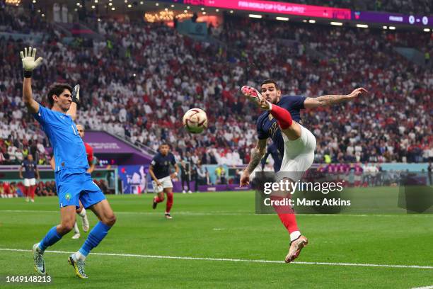 Theo Hernandez of France scores his team's first goal past Yassine Bounou of Morocco during the FIFA World Cup Qatar 2022 semi final match between...