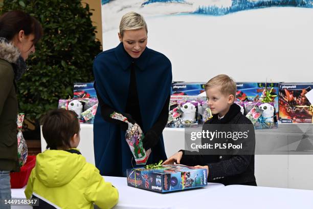 Princess Charlene of Monaco and Prince Jacques of Monaco attend the Christmas Tree at Monaco Palace on December 14, 2022 in Monaco, Monaco.