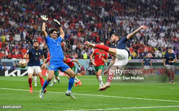 Theo Hernandez of France scores the team's first goal past Yassine Bounou of Morocco during the FIFA World Cup Qatar 2022 semi final match between...