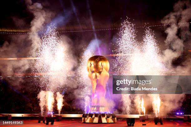 Pyrotechnics explode around a giant FIFA World Cup trophy prior to the FIFA World Cup Qatar 2022 semi final match between France and Morocco at Al...