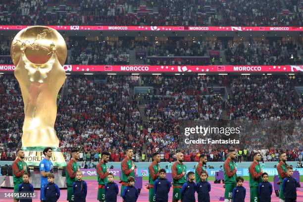 The Morocco team sings the national anthem prior to kick off in the FIFA World Cup Qatar 2022 semi final match between France and Morocco at Al Bayt...