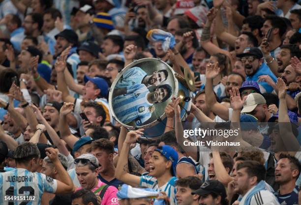 Argentina fans with a drum showing Lionel Messi and Diego Maradona during the FIFA World Cup Qatar 2022 semi final match between Argentina and...