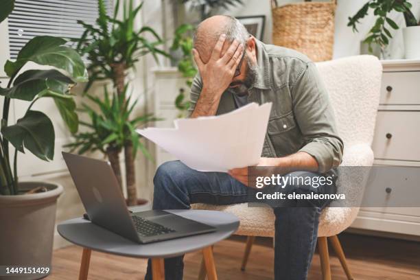mature man working from home - man mistake stock pictures, royalty-free photos & images