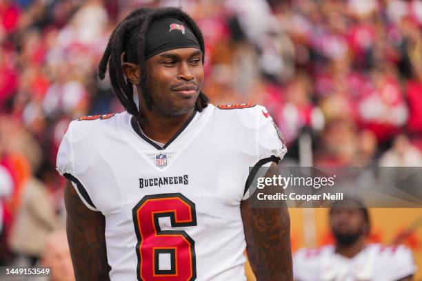Julio Jones of the Tampa Bay Buccaneers stands during the national anthem against the San Francisco 49ers at Levi's Stadium on December 11, 2022 in...
