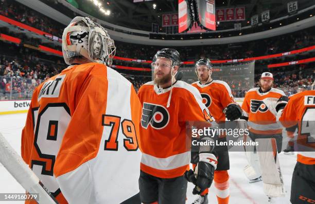 Carter Hart, Nicolas Deslauriers, Kevin Hayes and Felix Sandstrom of the Philadelphia Flyers celebrate after defeating the Colorado Avalanche 5-3 at...
