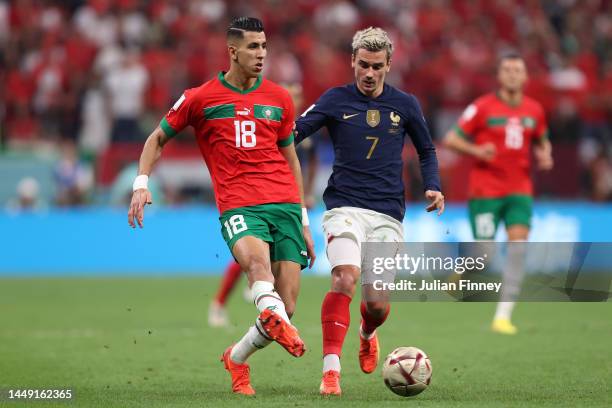 Jawad El Yamiq of Morocco is challenged by Antoine Griezmann of France during the FIFA World Cup Qatar 2022 semi final match between France and...
