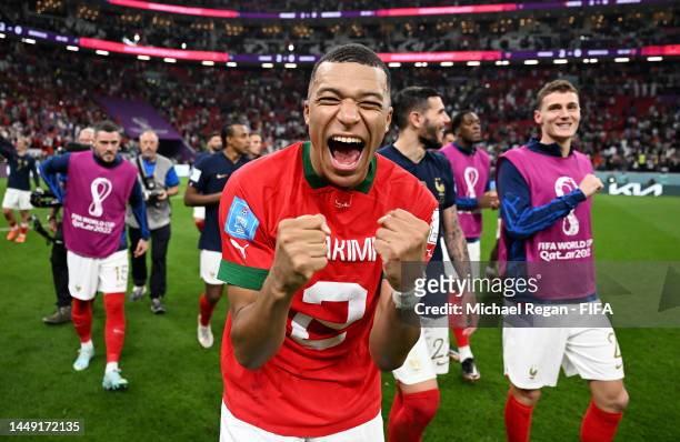 Kylian Mbappe of France celebrates the 2-0 win after exchanging shirts with Achraf Hakimi of Morocco during the FIFA World Cup Qatar 2022 semi final...