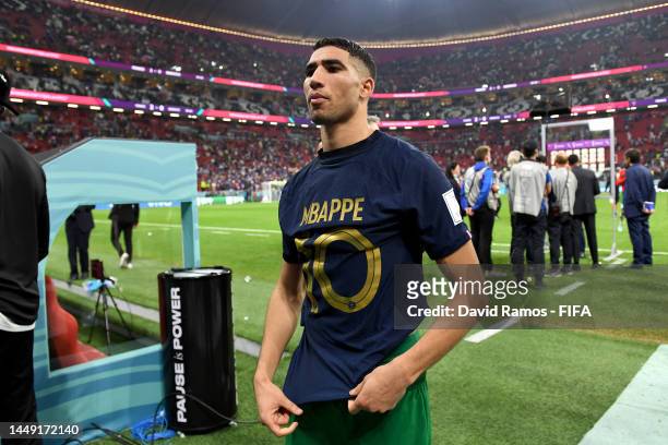 Achraf Hakimi of Morocco walks off the pitch after exchanging shirts with Kylian Mbappe of France during the FIFA World Cup Qatar 2022 semi final...
