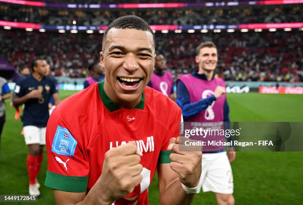 Kylian Mbappe of France celebrates the 2-0 win after exchanging shirts with Achraf Hakimi of Morocco during the FIFA World Cup Qatar 2022 semi final...