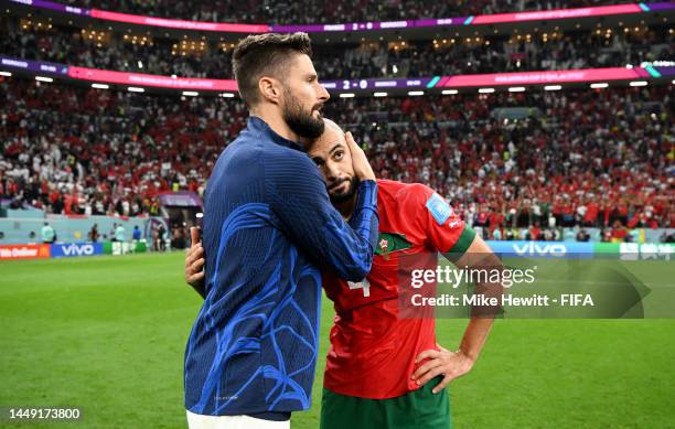 Sofyan Amrabat of Morocco is consoled by Olivier Giroud of France after the FIFA World Cup Qatar 2022 semi final match between France and Morocco at...