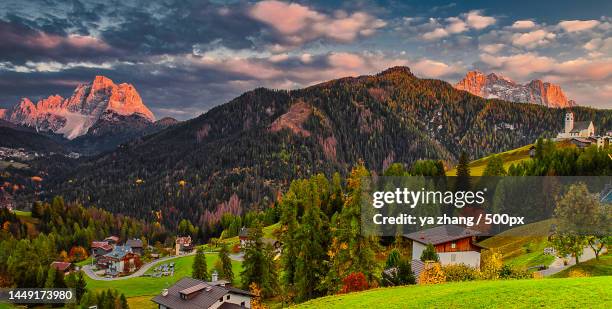 scenic view of trees and houses against sky,colle santa lucia,province of belluno,italy - colle santa lucia stock pictures, royalty-free photos & images
