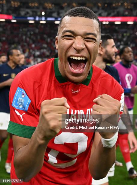 Kylian Mbappe of France celebrates the 2-0 win after exchanging shirts with Achraf Hakimi of Morocco during the FIFA World Cup Qatar 2022 semi final...