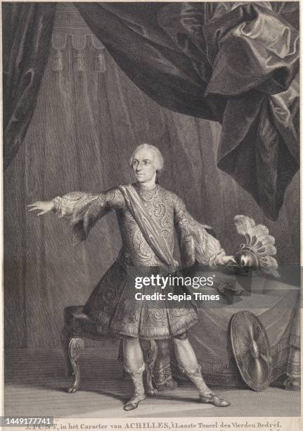Jan Punt as a stage actor on stage in the role of Achilles. He is standing near a table, against which his shield is leaning. In the margin a...