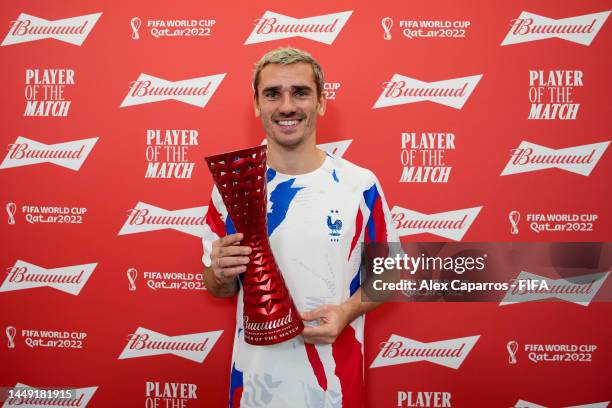 Antoine Griezmann of France poses with the Budweiser Player of the Match Trophy following the FIFA World Cup Qatar 2022 semi final match between...