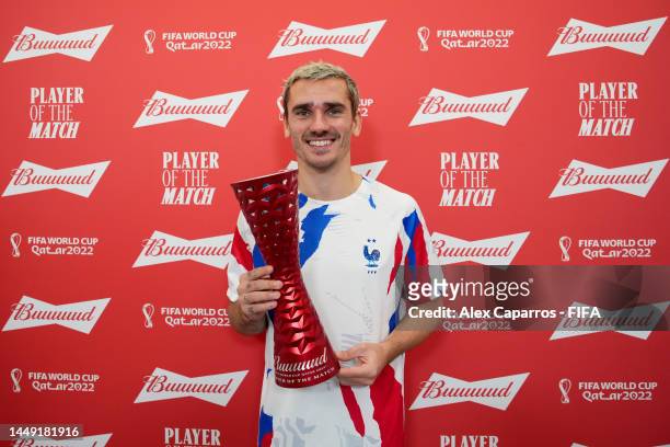 Antoine Griezmann of France poses with the Budweiser Player of the Match Trophy following the FIFA World Cup Qatar 2022 semi final match between...