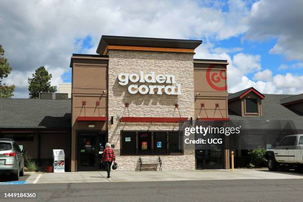 Entrance to Golden Corral buffet restaurant showing company logo above entry.