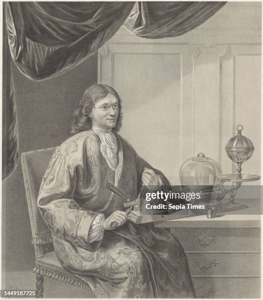 The person portrayed is seated at a table dressed in a dressing gown with floral motifs. He is turning an instrument standing on the table with both...