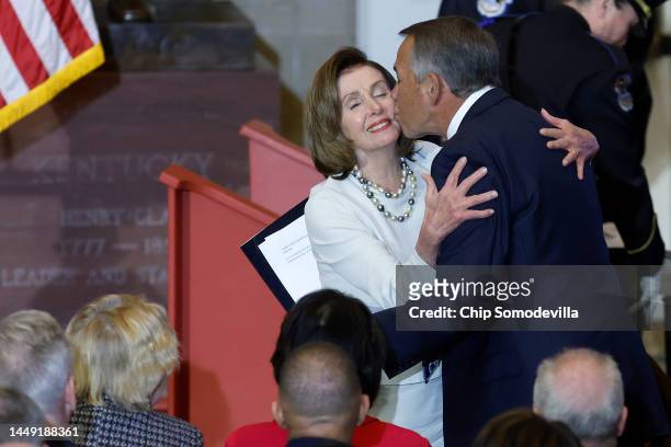Speaker of the House Nancy Pelosi gets a kiss from former Speaker John Boehner of Ohio during her portrait unveiling ceremony in Statuary Hall at the...