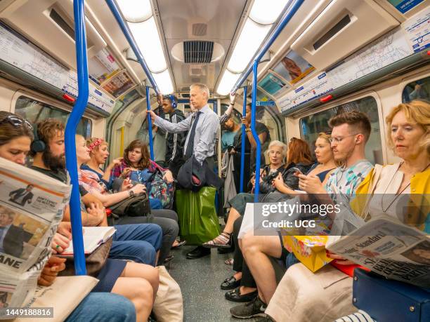 Crowded London Underground carriage, UK.