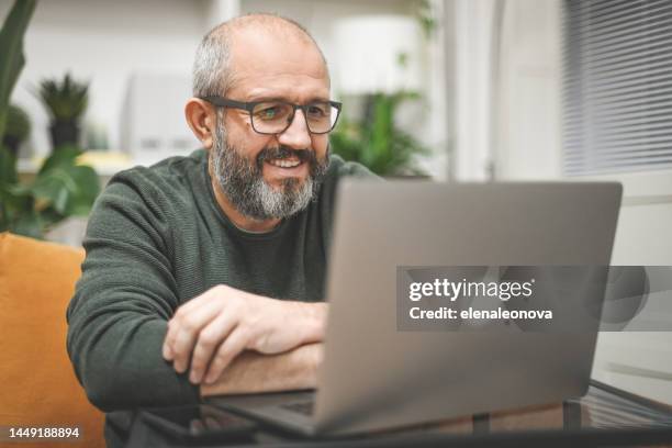 mature man working from home - online meeting stock pictures, royalty-free photos & images