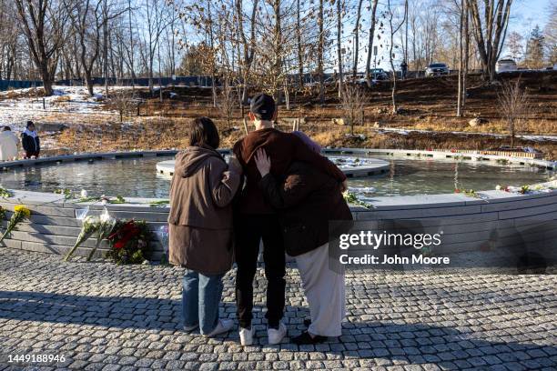 Visitors pay their respects at the Sandy Hook Permanent Memorial on the 10th anniversary of the school shooting on December 14, 2022 in Newtown,...