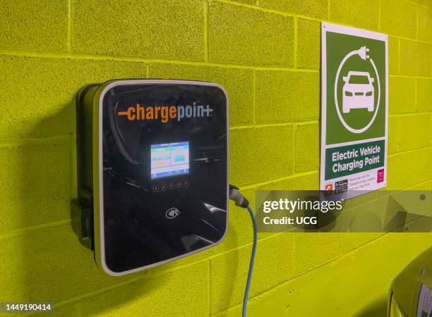 Newbury, Berkshire, England, UK, Electric car battery charging unit in an underground car park.