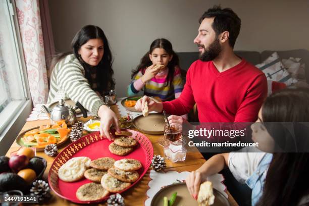 middle eastern family having a festive breakfast. - lebanese ethnicity stock pictures, royalty-free photos & images