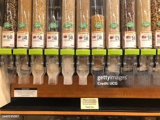 Wegmans Grocery Store Organic bulk shopping aisle with grains, cereals, nuts and more, Boston Massachusetts.