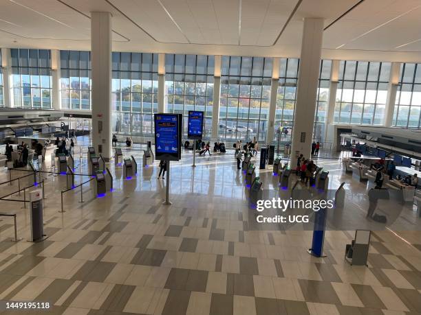 Main check in area with automated kiosks in newly renovated LaGuardia Airport terminal, Queens, New York.