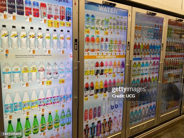 Digital display on doors of refrigerated beverages at Whole Foods, supermarket, Manhattan, New York.