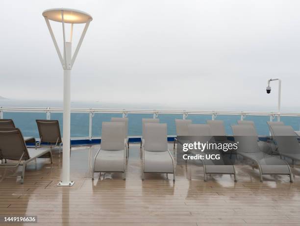 Wet afternoon on the sun deck a cruise ship in the North Sea.