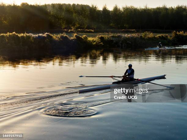 Sunrise with rowers on the Thames by St Helens Wharf, Abingdon.