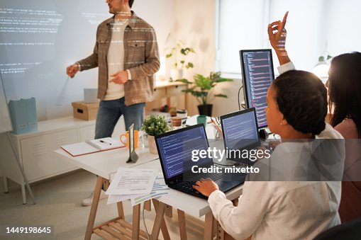 Giving Computer Lesson Teacher Giving Computer Science Lecture To In Small Home Office High ...