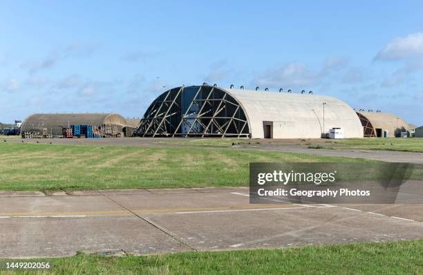 Aircraft hangars for jet fighter military planes, former USAF base, Bentwaters Park, Suffolk, England, UK.