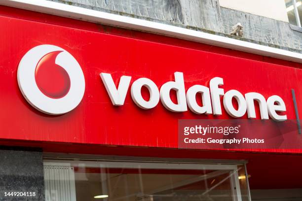 Shop store sign for Vodafone, Devizes, Wiltshire, England, UK.