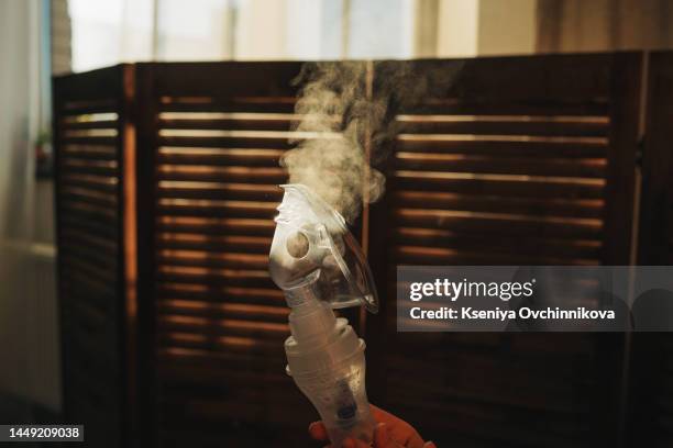 medical inhaler emergency equipment blue back smoke background, treatment illness asthma disease neutralizer oxygen spray inhaler therapy,drug allergic cough asthmatic attack hospital.selective focus - asthmatic stock pictures, royalty-free photos & images