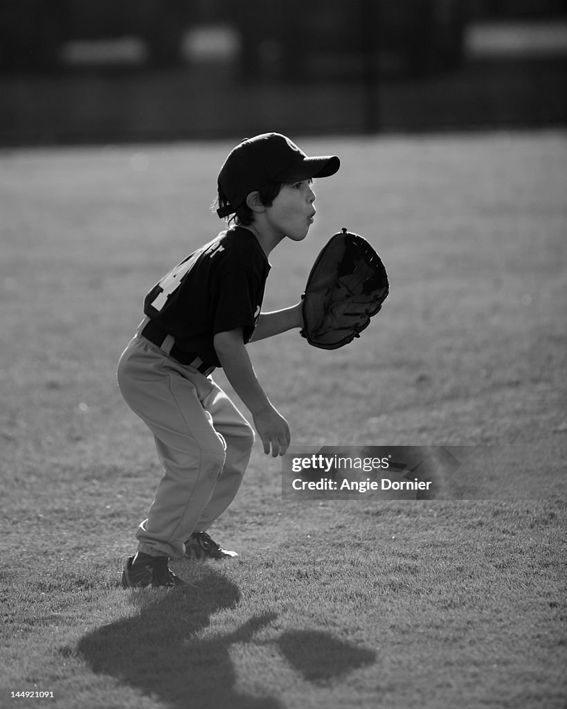 Boy playing Baseball