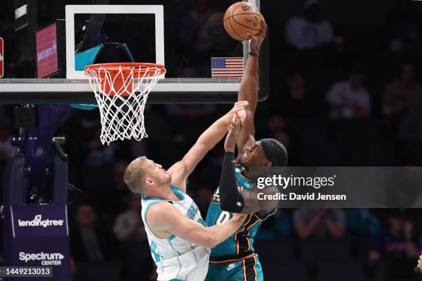 Jalen Duren of the Detroit Pistons dunks the ball against the Charlotte Hornets at Spectrum Center on December 14, 2022 in Charlotte, North Carolina....
